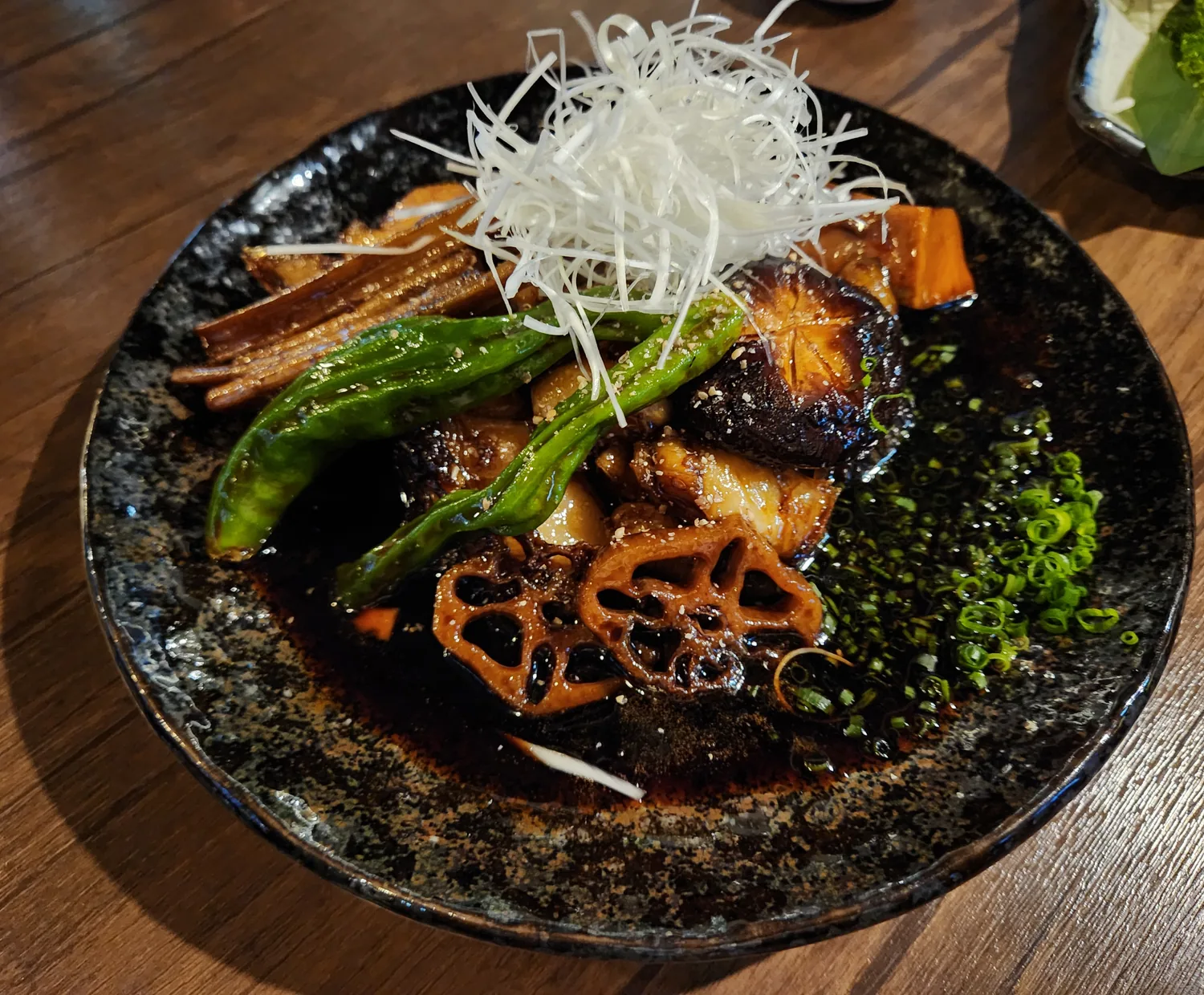 Grilled mero (Patagonian toothfish) with lotus root and shishito at Enwoo Pyeongchon