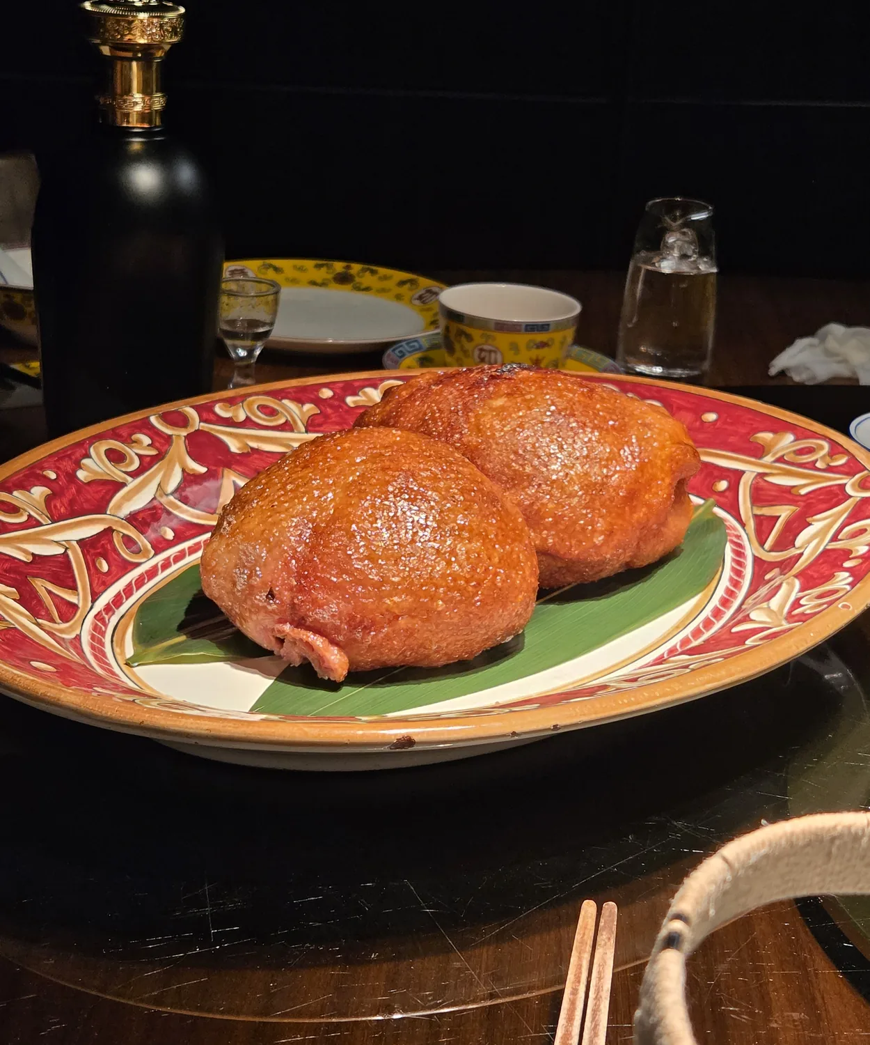 Eight-treasure duck whole on a red plate at Gyehyanggak