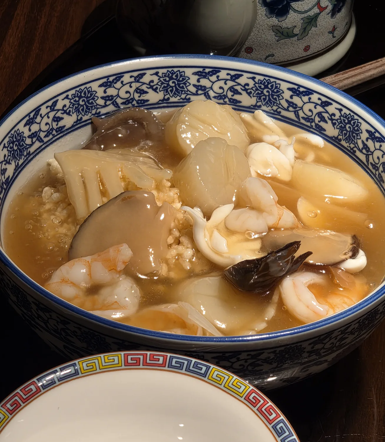Seafood nurungji soup with scallops, shrimp, and bamboo shoots at Gyehyanggak