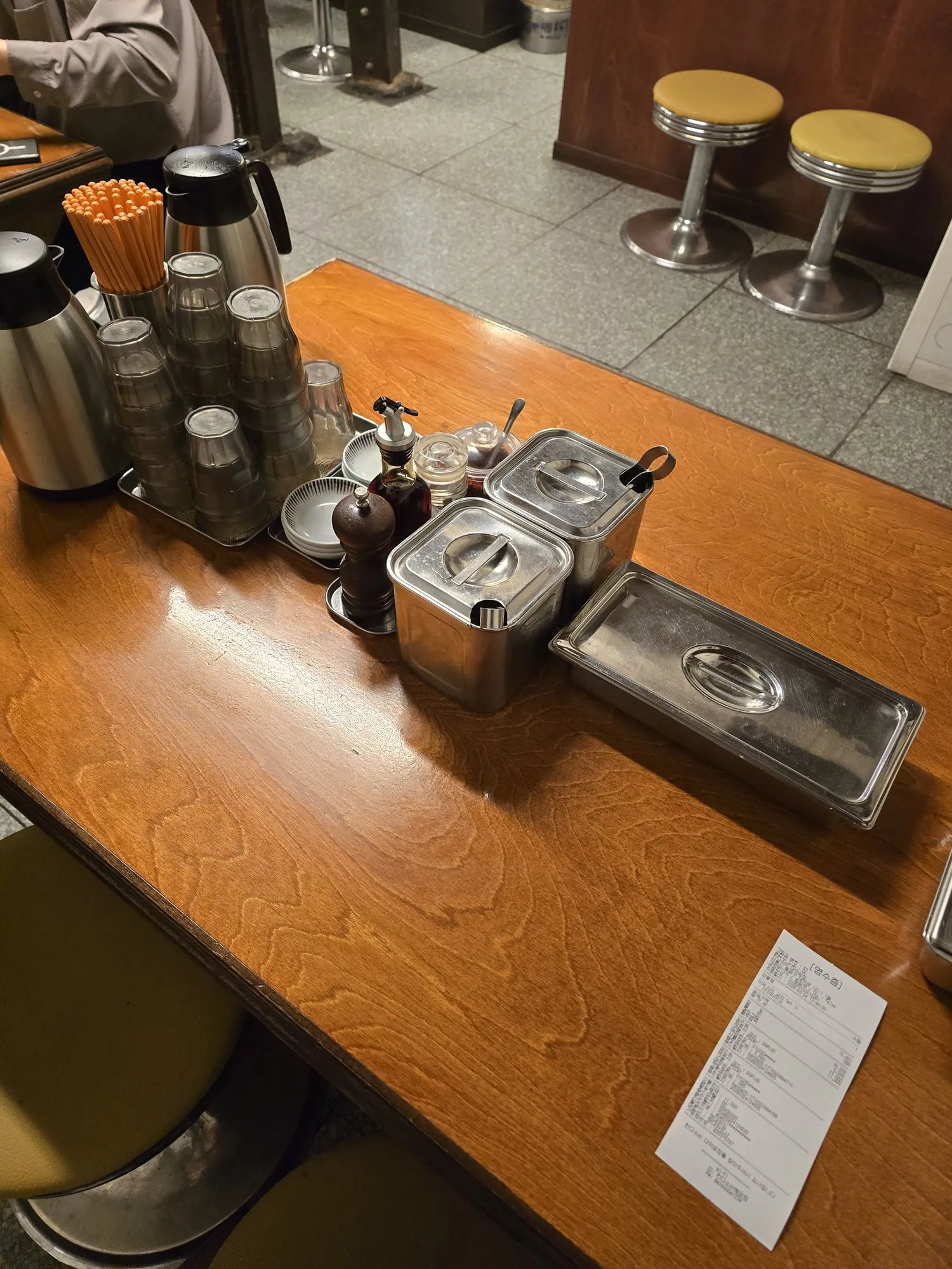 Counter setup with condiments and self-serve sides