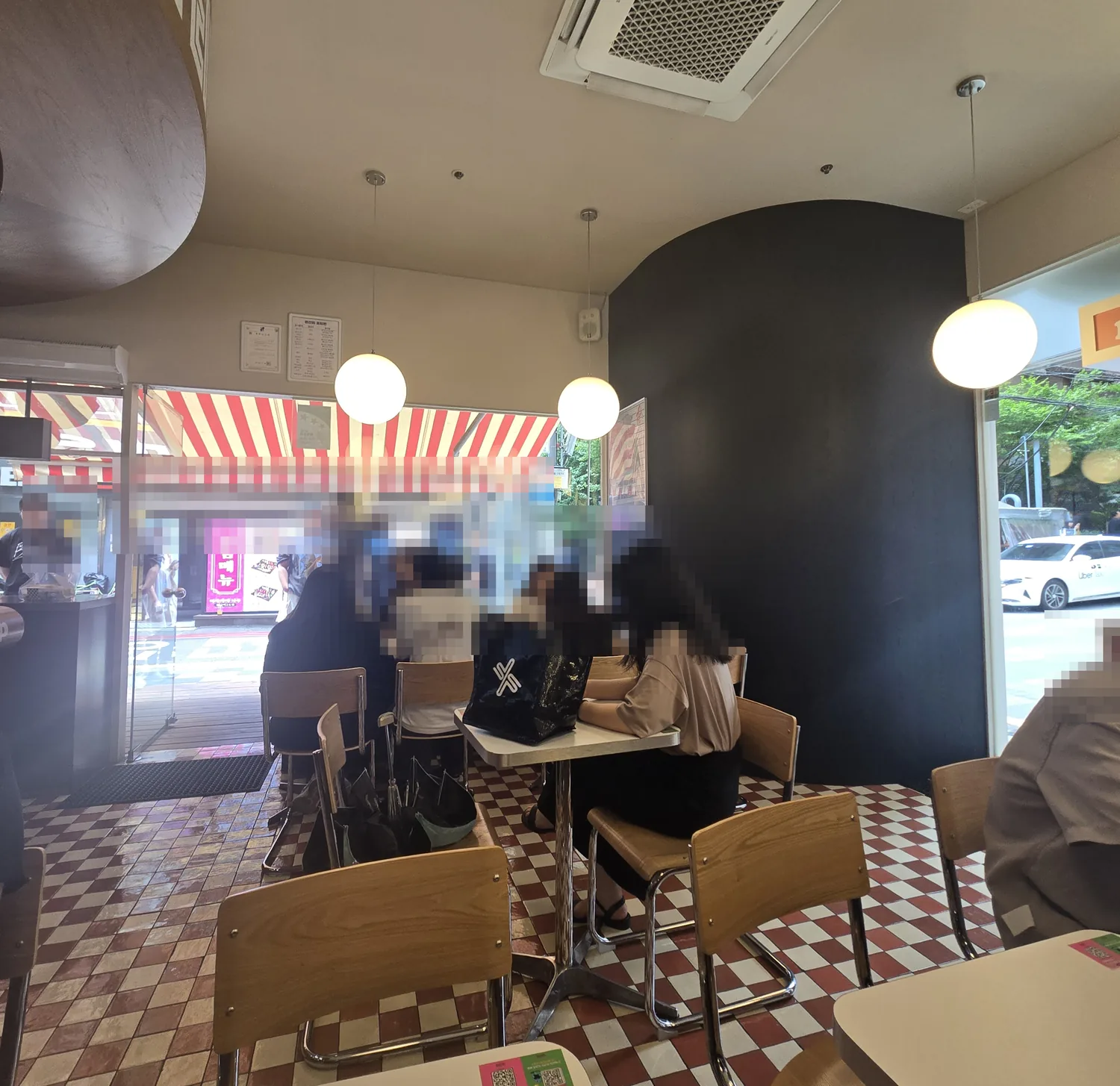 PROTEINER interior with diamond-tile floor and bar seating near Sinnonhyeon