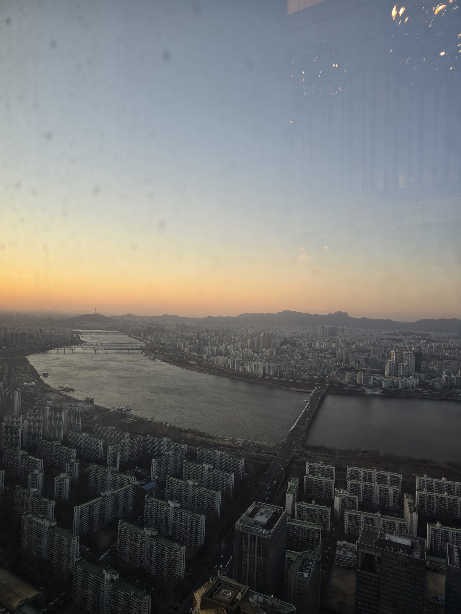 Sunset view of the Han River from STAY restaurant, 81st floor of Lotte World Tower