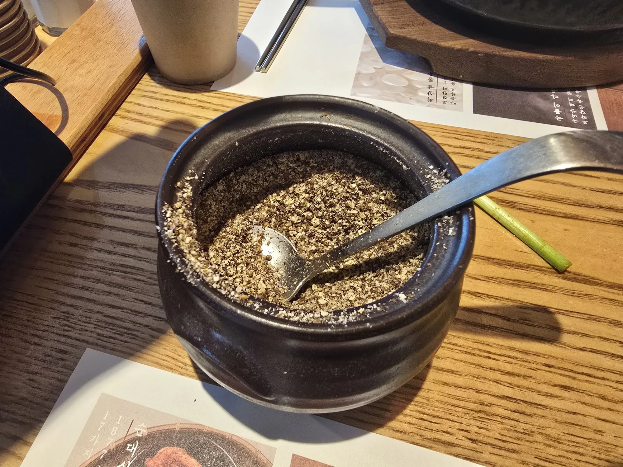 Perilla seed powder in a traditional black pot